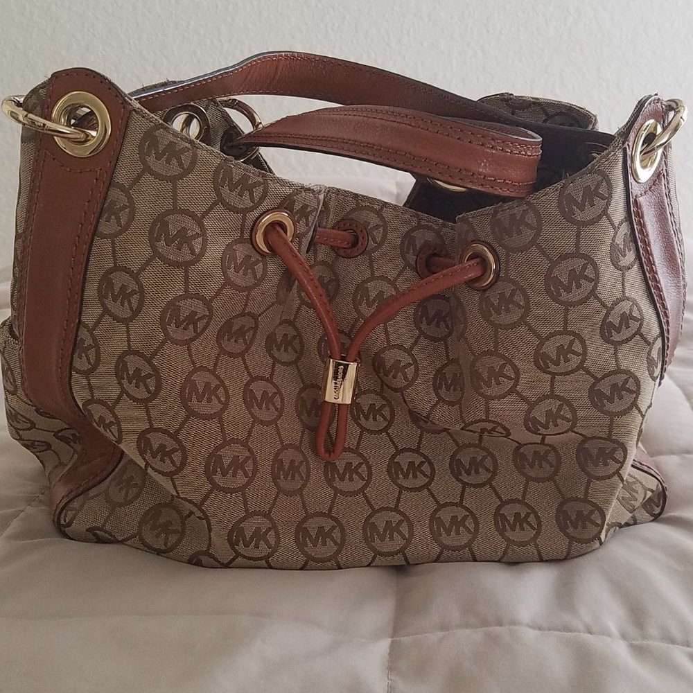 SOLD Michael Kors monogram purse. Leather and canvas. Brown and tan color.